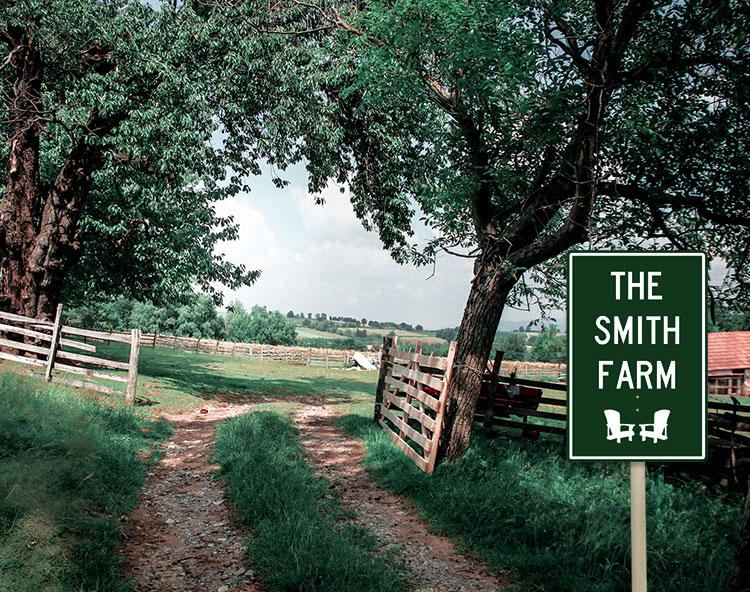 The road leading through the open gate to the farm. There is a sign by the road, The Smith Farm